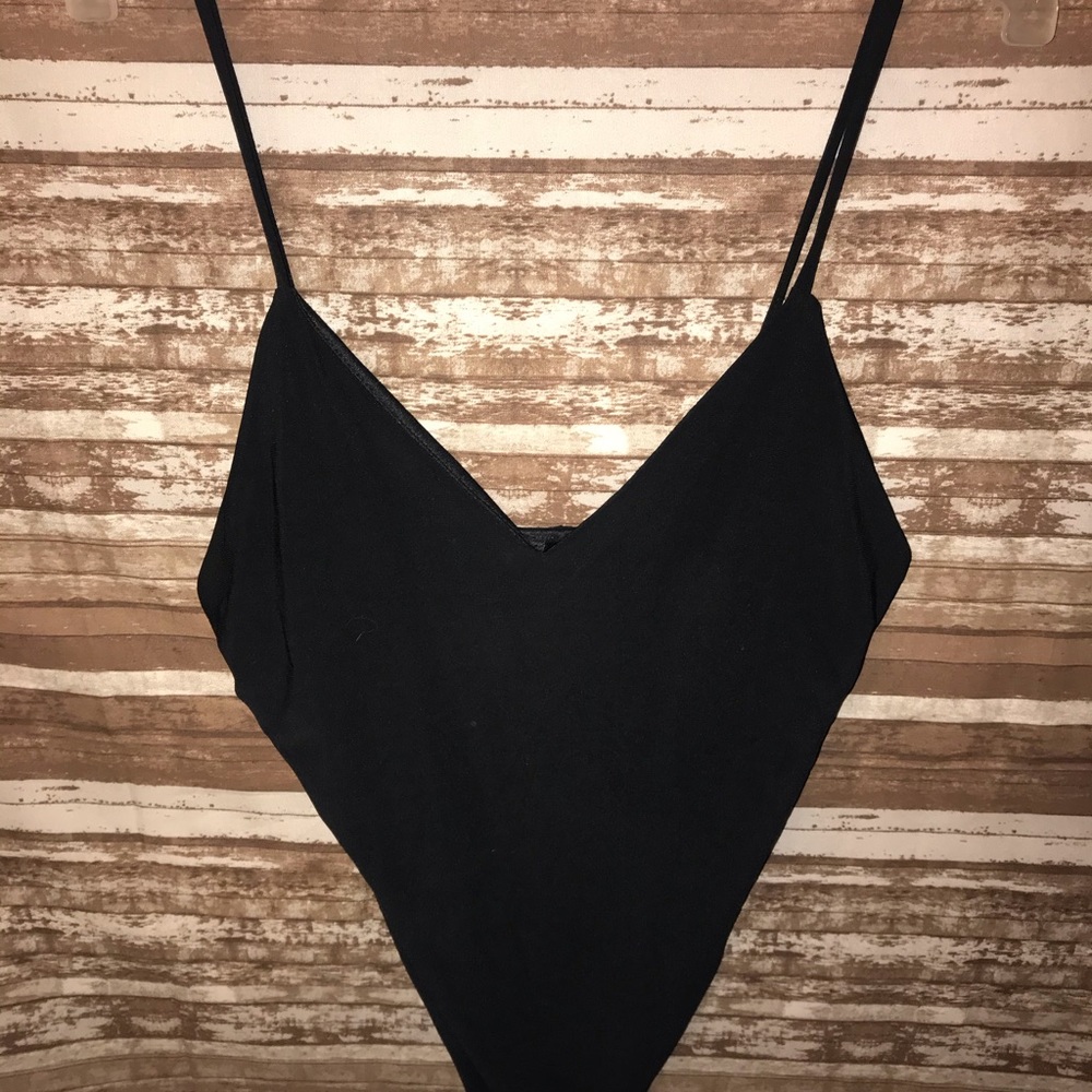Thin strapped black body suit